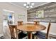 Dining room featuring round table, stylish chandelier, and accent wall at 5013 Franconia Dr, Summerville, SC 29485