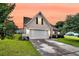 Charming one-story home featuring a two-car garage and a well-manicured front yard with lush landscaping at 5013 Franconia Dr, Summerville, SC 29485