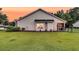 Charming exterior view showcasing the well-maintained lawn and beautiful landscaping around the house at 5013 Franconia Dr, Summerville, SC 29485