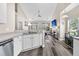 Bright kitchen overlooking the living room features modern appliances and bar at 5013 Franconia Dr, Summerville, SC 29485