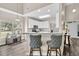 Inviting kitchen featuring white cabinetry, a breakfast bar, and modern appliances with a neutral color palette at 5013 Franconia Dr, Summerville, SC 29485