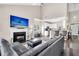 Open-concept living room featuring a fireplace, tv, and kitchen with bar seating at 5013 Franconia Dr, Summerville, SC 29485