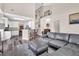 Open-concept living room featuring a comfortable sectional and adjacent dining area at 5013 Franconia Dr, Summerville, SC 29485