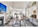 Open-concept living room featuring a fireplace, tv, and kitchen with bar seating at 5013 Franconia Dr, Summerville, SC 29485