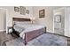 Main bedroom suite featuring a king bed, art and an ensuite bathroom at 5013 Franconia Dr, Summerville, SC 29485