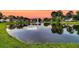 Scenic pond view surrounded by lush greenery and waterfront homes, creating a serene neighborhood setting at 5013 Franconia Dr, Summerville, SC 29485