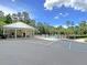 Community pool area featuring ample parking, a covered pavilion, and a gated pool at 5013 Franconia Dr, Summerville, SC 29485