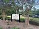 Wescott Plantation Swim Club signage surrounded by trees, highlighting amenities like the pool and clubhouse at 5013 Franconia Dr, Summerville, SC 29485