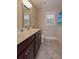 Bathroom featuring double sinks, dark wood cabinets, and modern fixtures at 5540 Indigo Fields Blvd, North Charleston, SC 29418