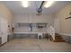 Spacious garage with high ceilings, built-in shelving, and easy access to interior at 5540 Indigo Fields Blvd, North Charleston, SC 29418