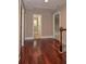 Hallway with wood floors and a view of the bathroom at 5540 Indigo Fields Blvd, North Charleston, SC 29418