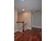 Hallway with wood floors and a staircase at 5540 Indigo Fields Blvd, North Charleston, SC 29418