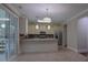 Open kitchen with stainless steel appliances, granite countertops, view to the backyard through sliding glass doors at 5540 Indigo Fields Blvd, North Charleston, SC 29418