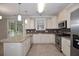 Modern kitchen with stainless steel appliances, granite countertops, and tile backsplash at 5540 Indigo Fields Blvd, North Charleston, SC 29418