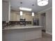 Bright kitchen with stainless steel appliances, granite countertops, and a spacious island at 5540 Indigo Fields Blvd, North Charleston, SC 29418