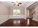 Bright living room with hardwood floors, crown molding, and a large window overlooking the yard at 5540 Indigo Fields Blvd, North Charleston, SC 29418