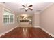 Open concept living room with hardwood floors, view of the kitchen, and plenty of natural light at 5540 Indigo Fields Blvd, North Charleston, SC 29418