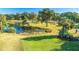 Scenic golf course with a tranquil pond, lush greenery, and mature trees creating a serene atmosphere at 5802 Palmetto Dr # B314, Isle of Palms, SC 29451