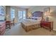 Comfortable bedroom with a bed, a work desk, and access to the balcony at 5802 Palmetto Dr # B314, Isle of Palms, SC 29451
