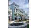 Inviting multi-story building with a courtyard featuring outdoor seating and a cozy fire pit at 5802 Palmetto Dr # B314, Isle of Palms, SC 29451