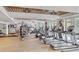 The gym has a wood plank ceiling and is equipped with treadmills, ellipticals, weight machines, and free weights at 5802 Palmetto Dr # B314, Isle of Palms, SC 29451