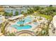 Beautiful aerial view of a pool area with lounge chairs and lush landscaping at 5802 Palmetto Dr # B314, Isle of Palms, SC 29451