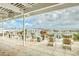 Inviting outdoor patio with comfortable seating, offering panoramic views and a relaxing setting at 5802 Palmetto Dr # B314, Isle of Palms, SC 29451