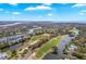 Stunning aerial view showcasing a golf course community, winding waterways, and beautiful homes at 5802 Palmetto Dr # B314, Isle of Palms, SC 29451