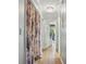 Bright hallway with wood floors and a decorative light fixture at 607 Greencastle Dr, Goose Creek, SC 29445