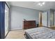 Bedroom with a dresser, queen bed, ceiling fan, and sliding glass door to balcony at 607 Greencastle Dr, Goose Creek, SC 29445