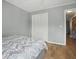 Bedroom featuring neutral walls, wood floors, closet with folding doors and bed at 607 Greencastle Dr, Goose Creek, SC 29445