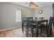 Bright dining area featuring an updated light fixture and a large window at 607 Greencastle Dr, Goose Creek, SC 29445