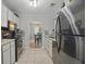 Charming kitchen with stainless steel appliances and tiled flooring at 607 Greencastle Dr, Goose Creek, SC 29445