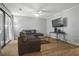 Open-concept living room with hardwood floors and sliding glass doors to outside at 607 Greencastle Dr, Goose Creek, SC 29445