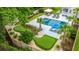 An aerial view of backyard with pool and custom putting green offers a tranquil retreat for recreation at 619 Thomas Glenn Ct, Charleston, SC 29412