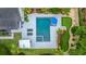 Aerial view of backyard oasis with pool, putting green, and lush landscaping for outdoor enjoyment at 619 Thomas Glenn Ct, Charleston, SC 29412