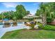 Inviting backyard with a pool, lounge chairs, and outdoor seating area under a shade umbrella at 619 Thomas Glenn Ct, Charleston, SC 29412