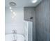 Modern bathroom with freestanding tub and gray tiled shower at 619 Thomas Glenn Ct, Charleston, SC 29412
