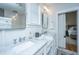 Bathroom featuring dual sinks with marble countertops and modern lighting at 619 Thomas Glenn Ct, Charleston, SC 29412