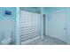 Light blue bathroom featuring a shower with a striped curtain and modern fixtures at 619 Thomas Glenn Ct, Charleston, SC 29412