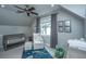 Cozy Bedroom featuring a crib, comfortable chair, and playful dinosaur themed decor at 619 Thomas Glenn Ct, Charleston, SC 29412