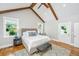 Vaulted ceiling bedroom featuring wooden beams, hardwood floors, and large windows at 619 Thomas Glenn Ct, Charleston, SC 29412
