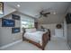 Bedroom featuring a wooden bed, window, ceiling fan, and unique wall art at 619 Thomas Glenn Ct, Charleston, SC 29412