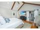 Bedroom featuring hardwood floors, vaulted ceiling, wooden beams, and barn door access at 619 Thomas Glenn Ct, Charleston, SC 29412