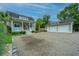 Charming home featuring a spacious driveway, a detached garage, and a welcoming front porch at 619 Thomas Glenn Ct, Charleston, SC 29412