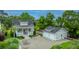 Beautiful home with a covered front porch, a detached two-car garage, and a well-manicured yard at 619 Thomas Glenn Ct, Charleston, SC 29412