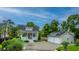 Charming home with a welcoming porch, a spacious driveway, and a detached two-car garage at 619 Thomas Glenn Ct, Charleston, SC 29412