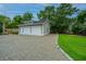 Detached two-car garage with ample parking space and well-maintained landscaping at 619 Thomas Glenn Ct, Charleston, SC 29412