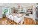 Bright kitchen with a large island, stainless steel appliances, and modern lighting, creating a perfect space for cooking and gathering at 619 Thomas Glenn Ct, Charleston, SC 29412