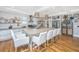 Elegant kitchen with a large center island, stainless steel appliances, and open shelving, perfect for cooking and gathering at 619 Thomas Glenn Ct, Charleston, SC 29412